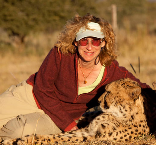 Sy with a cheetah in Namibia: credit Nic Bishop